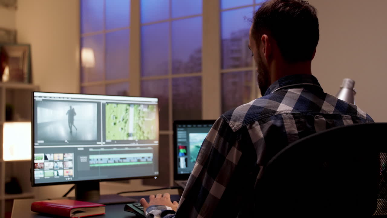 Person editing video on computer