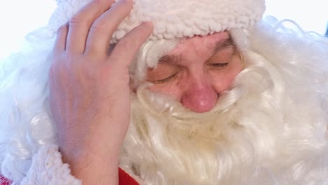 the face of a tired santa claus the face of a tired santa claus christmas and new year concept santa is sleeping