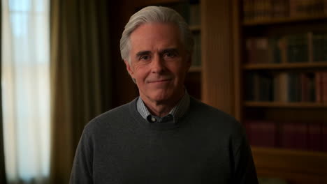 portrait of an older man with grey hair