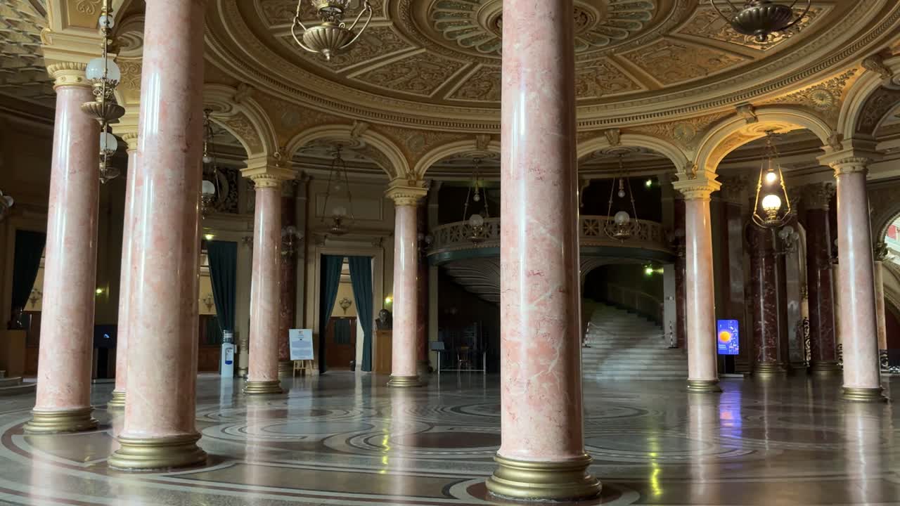 Romanian athenaeum luxurious interior without people. Panning view