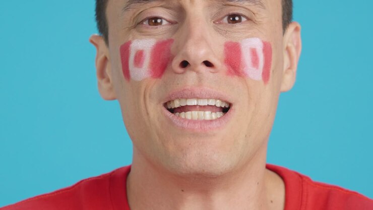 Uomo molto nervoso che fa il tifo per la squadra canadese durante una partita difficile