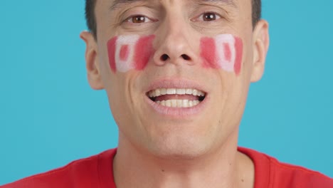 very nervous man supporting canadian team during a difficult match
