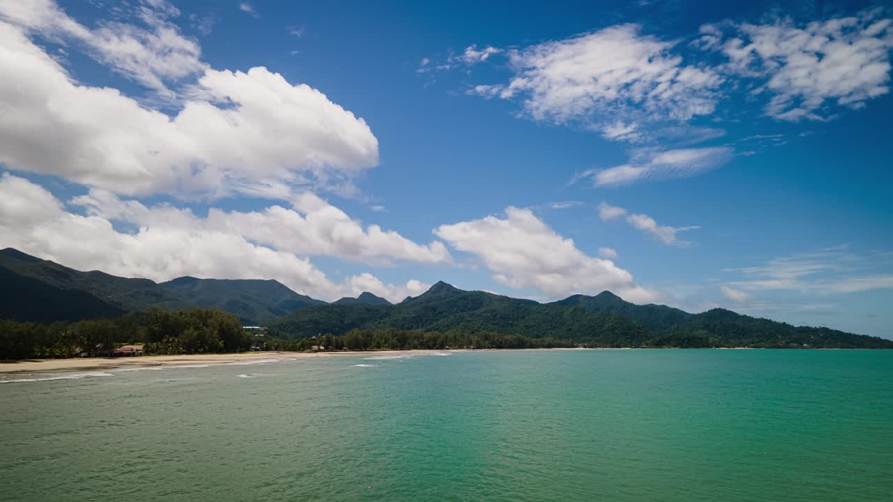 4K Drone Timelapse and Hyperlapse with Beautiful Landscape Scenery in Paradise Flying Low to Water Along Beach Front and Deep Blue Skies Over the Island of Koh Chang, Thailand