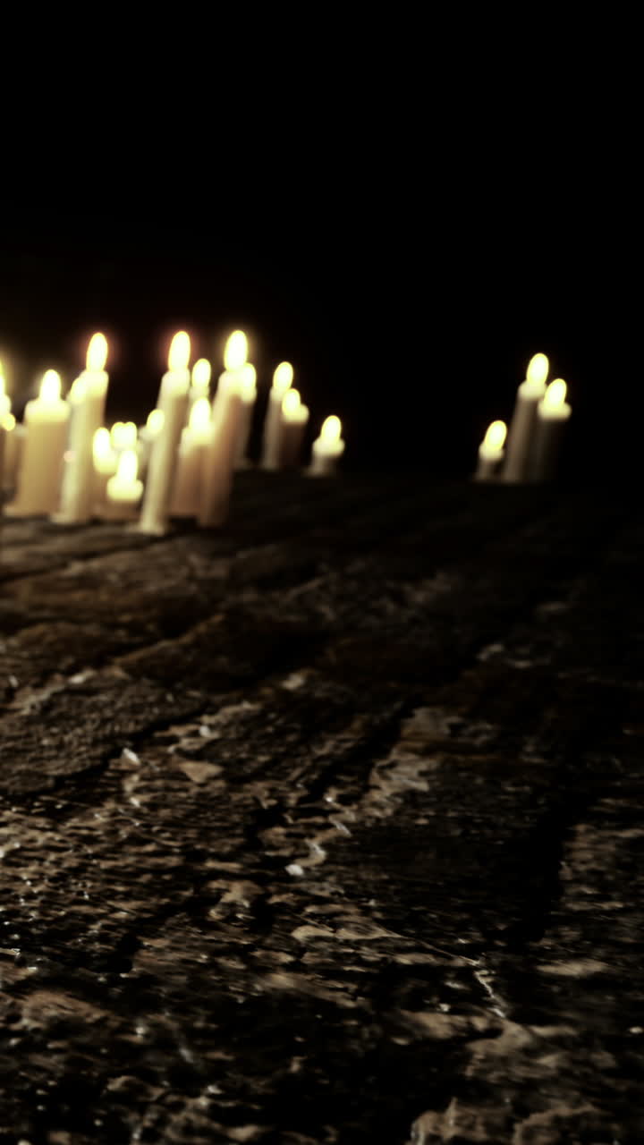 Candles brighten a dark space during a gathering in a quiet location