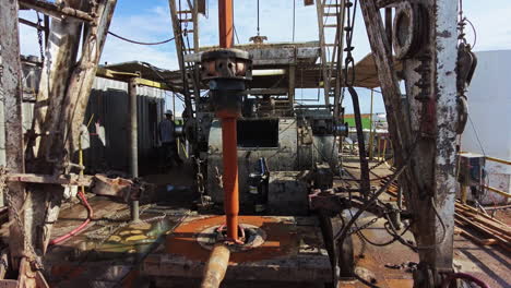 metal borer rotates drilling the ground. modern site for oil production in the field. working equipment for natural resources boring.