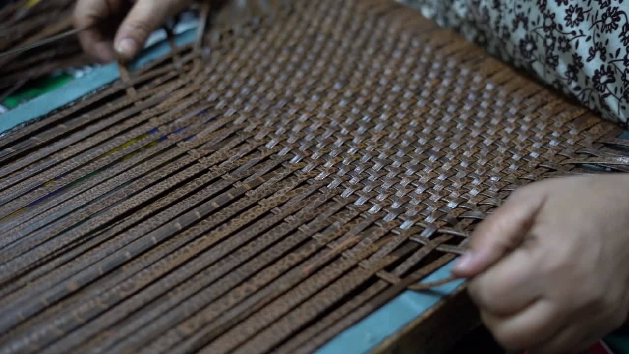a craftsman handmade a bag by needle, close up shot, insert shot