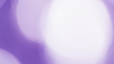 video of flickering white and purple bokeh spots of light with copy space