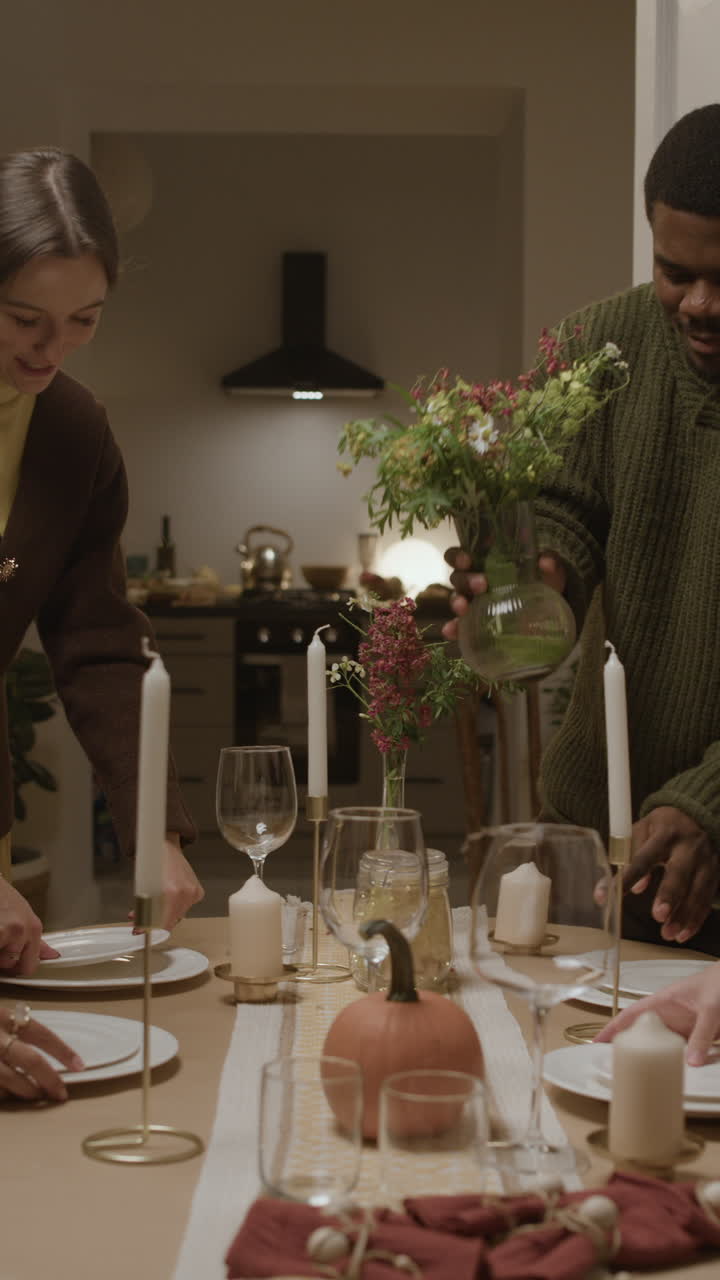 People setting a festive table