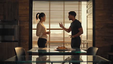 young multi ethnic couple navigating relationship dynamics, sharing intimate conversation in sunlit modern kitchen, exchanging perspectives with warmth and understanding