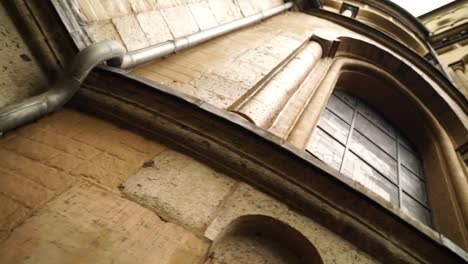 dynamically rotating camera on the stone wall of an st maria church at the capitol in germany