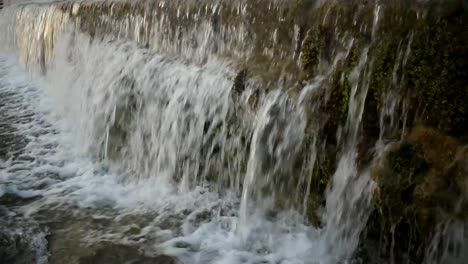 catching a waterfall in a small freshwater channel.
