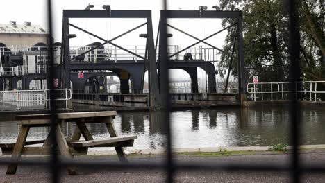 industrial victorian anderton canal lift waterway through gate fence barrier slow dolly left