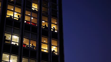 night view of a tall building with people