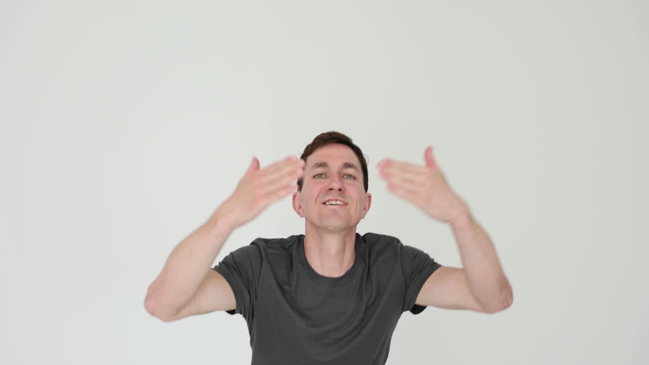Man Gesturing Expressively on White Background