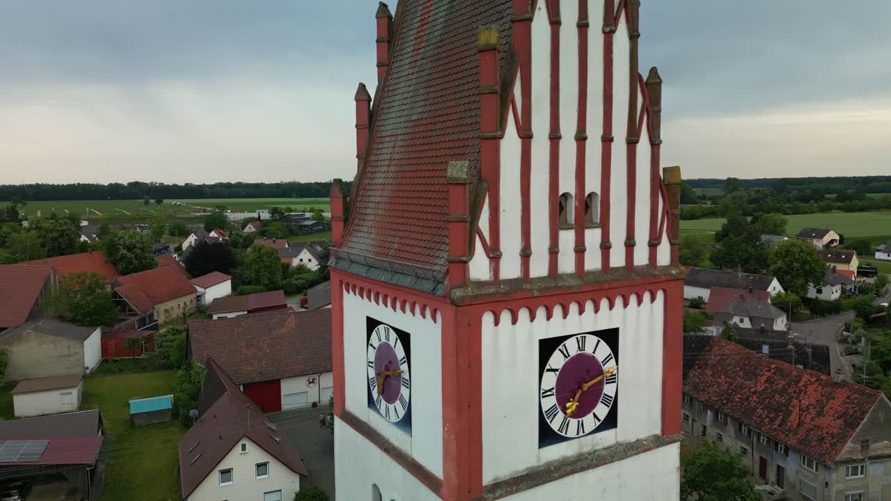 Spire and clock of Saint Mari&auml; Geburt Church in Bubesheim in Germany
