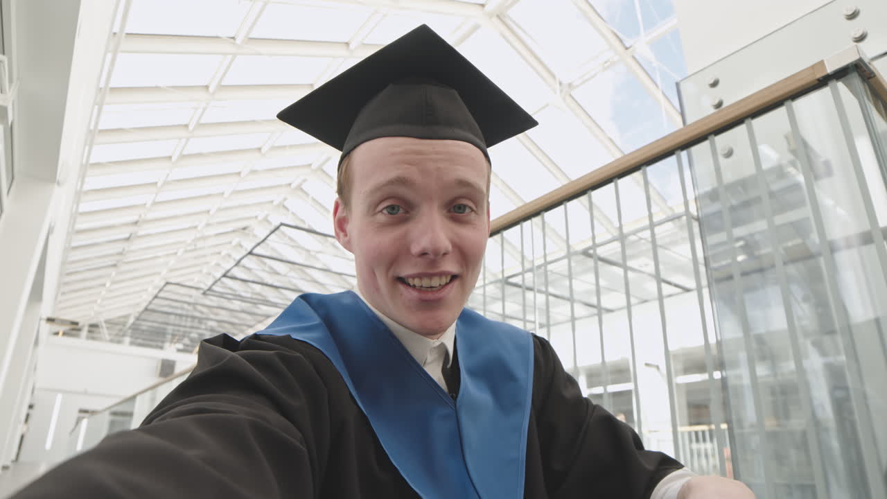 Male Caucasian Graduate Making Video Call