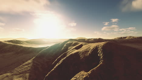 vast sunlit landscape with rolling hills stretching towards the horizon