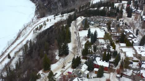 aerial drone fly over park in alberta edmonton valley ridge massive homes of glenora winter birds eye view by the north saskatchewan river tall trees old money by the government house property 3-4