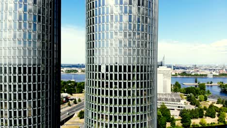 aerial shot of skyscrapers in riga, latvia, cityscape on the background. twin glass office buildings.