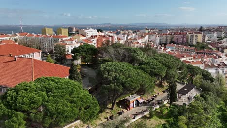 drone shot flying towards a view point park in lisbon