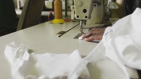 african man sewing tissue