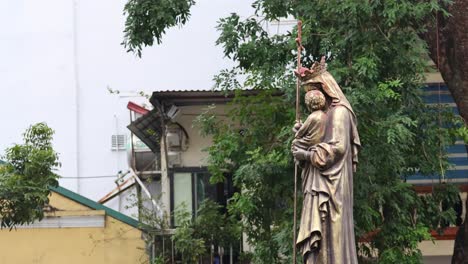 statue of religious figure near cathedral