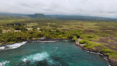 aerial view of punaluʻu beach on a cloudy day, big island, hawaii - drone shot