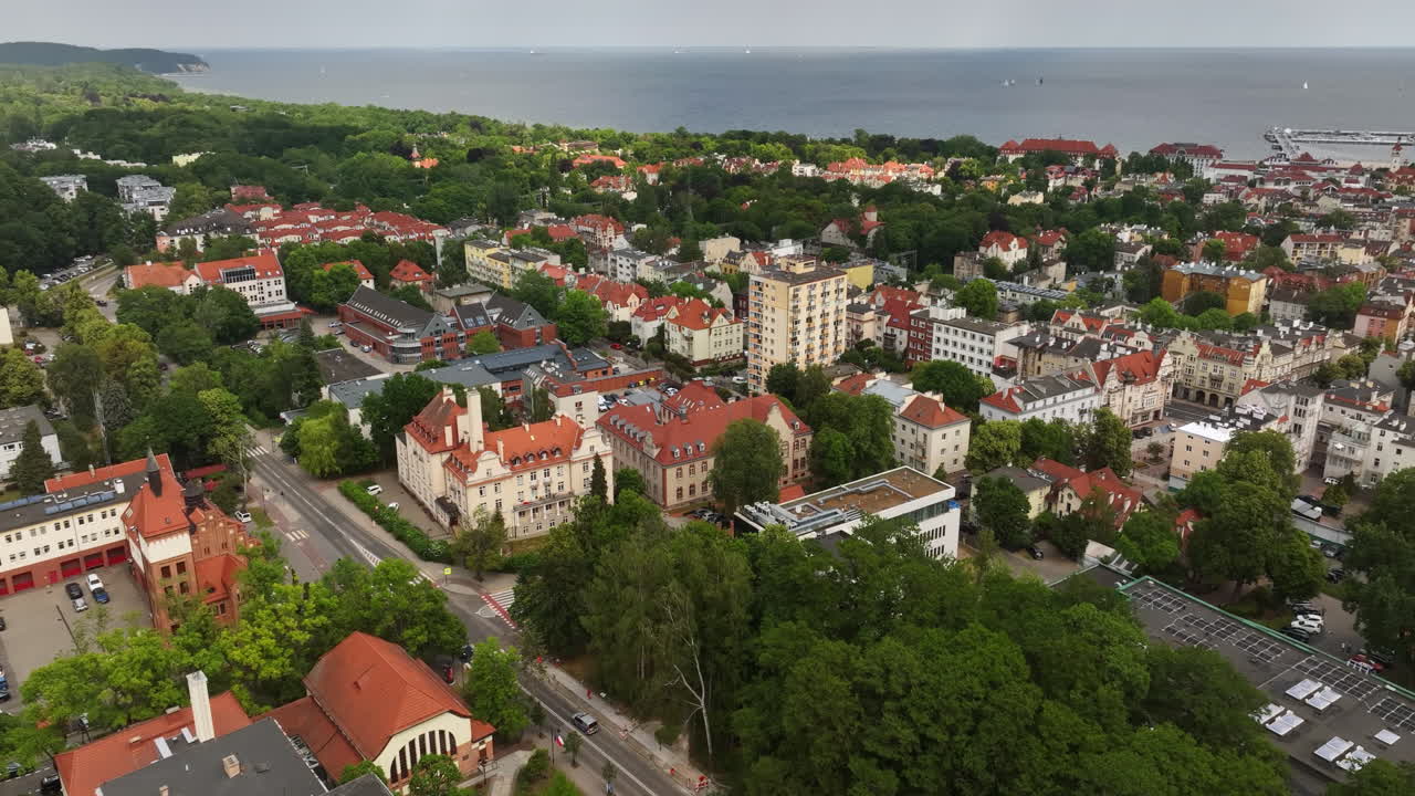 Drone flying sideways over the Sopot cityscape, sunny, summer day in Poland