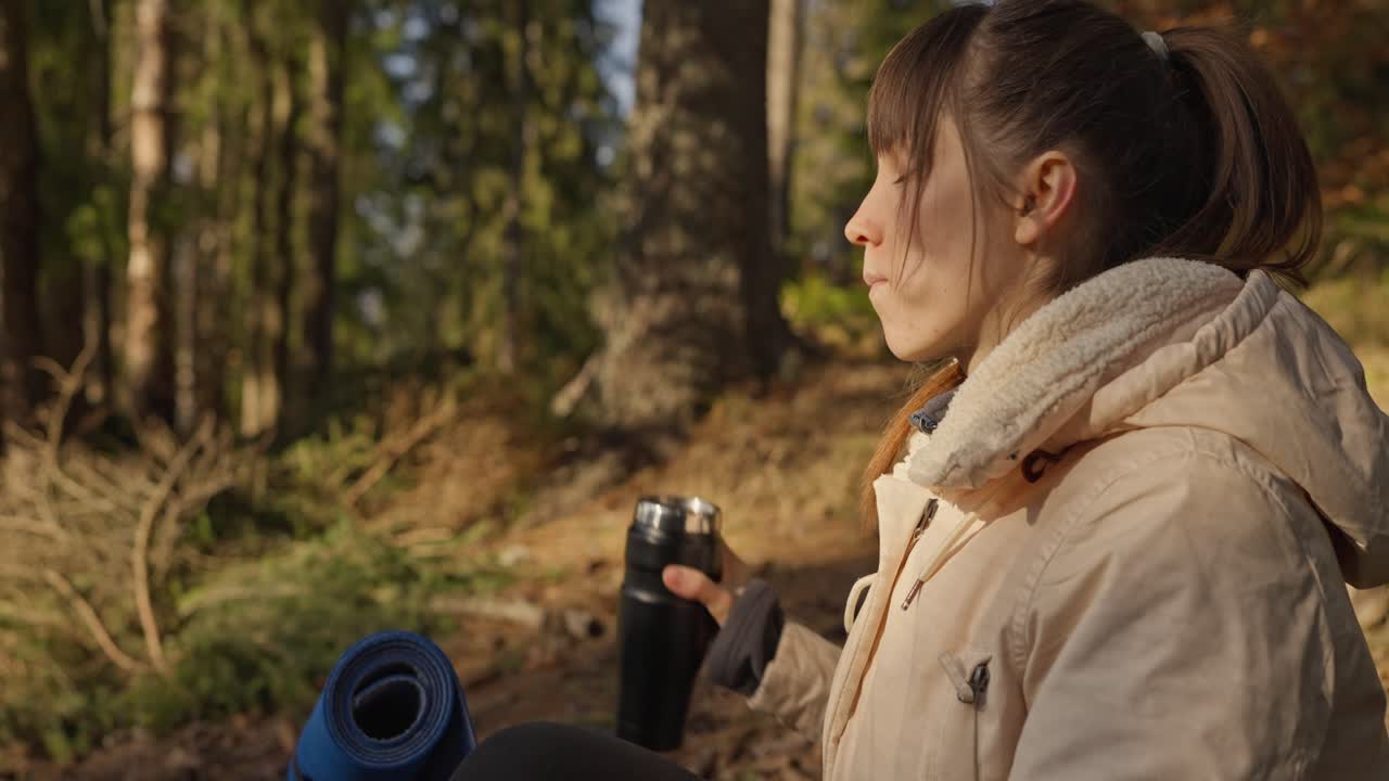 Woman taking a break in the forest