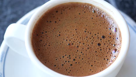 turkish coffee in a small white cup