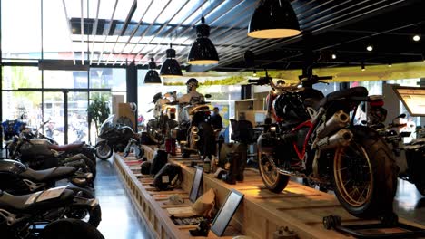 there is a motorcycle shop with an exhibition of motorcycles on display