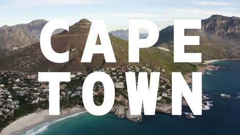 Drone-shot-of-coastline-With-Ocean-And-Countryside-In-South-Africa-Overlaid-With-Animated-Graphic-Spelling-Out-Cape-Town