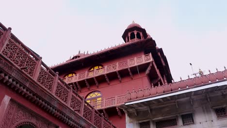 ancient-artistic-red-stone-holy-jain-temple-at-morning-video-is-taken-at-Soni-Ji-Ki-Nasiya-Jain-Temple,-Ajmer,-Rajasthan,-India