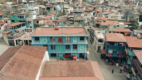 colorful structures in the town of santa catarina palopo, lake atitlan, guatemala - drone ascending