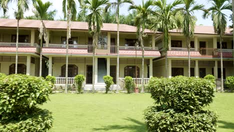 green courtyard of the hotel in asia. village in chitwan national park, nepal.