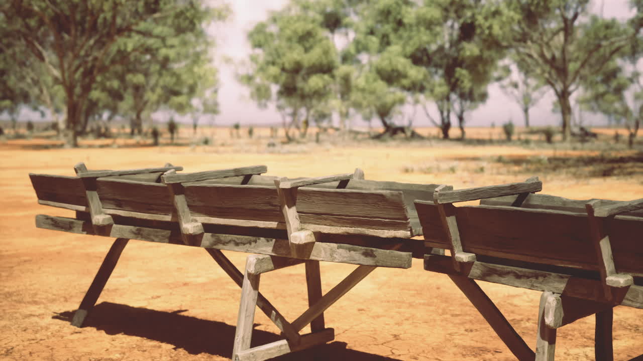 Rustic wooden trough under a vast blue sky in a remote australian landscape