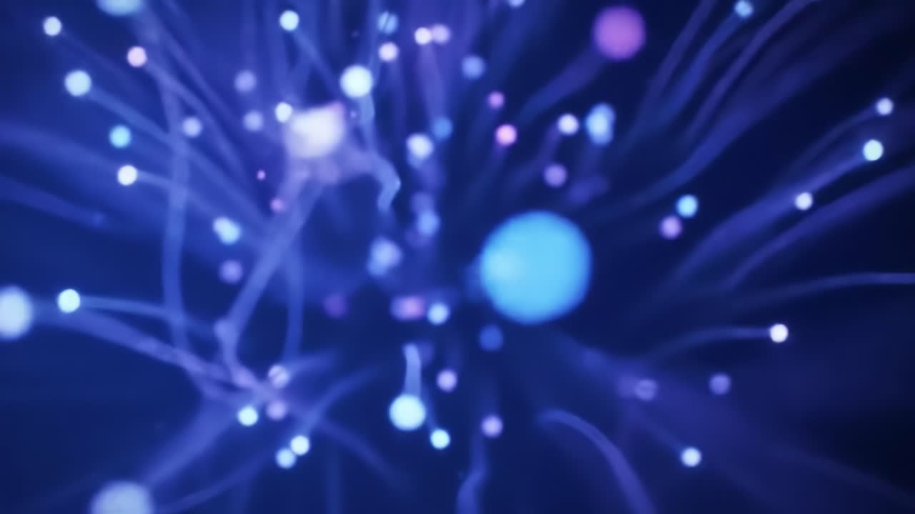 Bright blue and white lights swirl and pulse against a dark background, creating an enchanting atmosphere. The vibrant patterns shift dynamically, captivating viewers with their beauty.