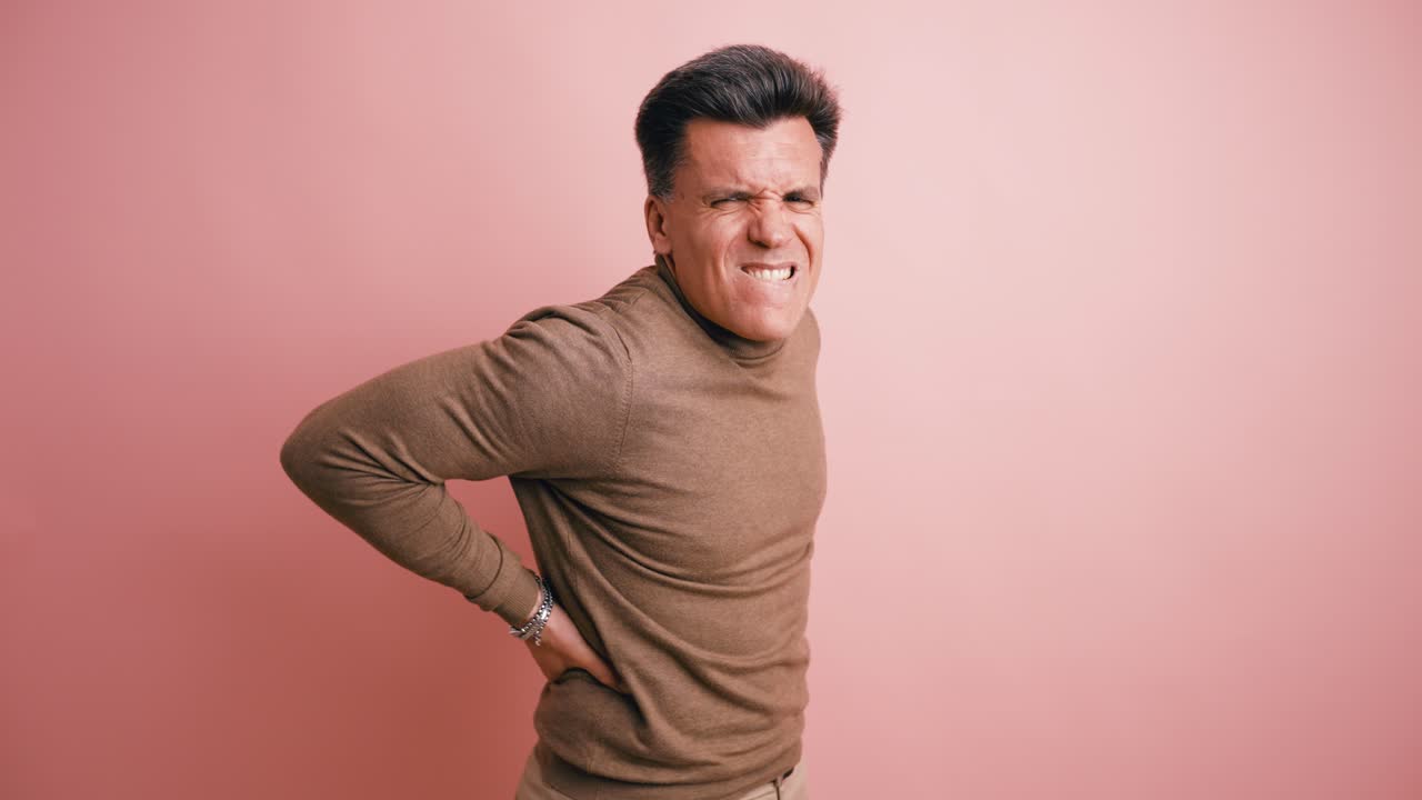 Middle-Aged Man Suffering from Severe Lower Back Pain