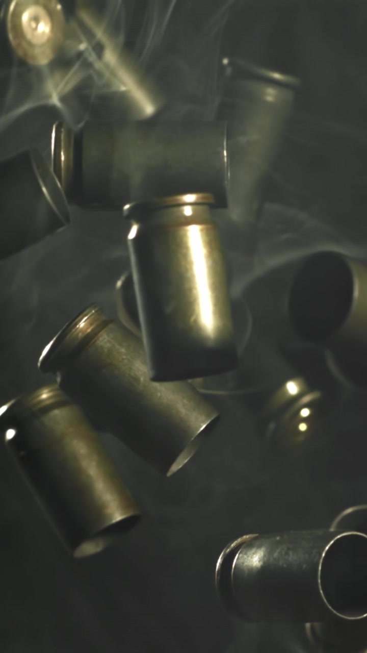 Empty Bullet Casings Falling in Slow Motion with Smoke