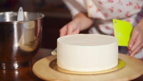 woman decorating a beautiful cake