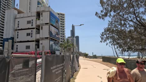 scenes of construction and relaxation by the beach