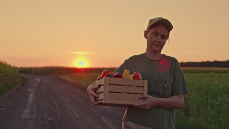 farmer at sunset with harvest crate