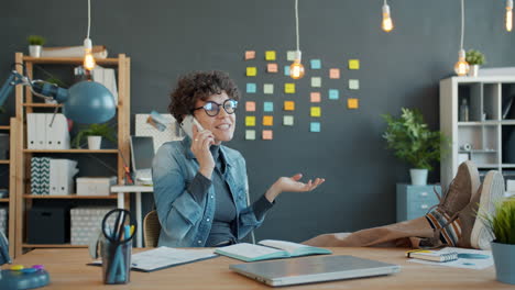 woman in a modern office on a phone call