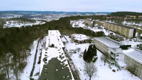 forward moving aerial over buildings all covered with snow during winter