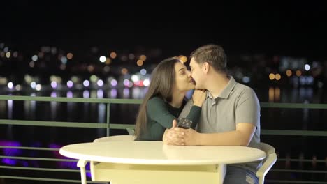 couple's romantic night date on a balcony