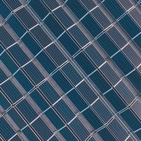 solar panels outdoors. landscape picture of solar farm. green alternative energy concept. aerial view. camera rises up.