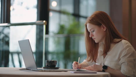 online education young woman is learning remotely sitting at home and viewing lecture by laptop