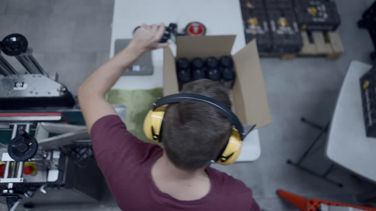 Factory Worker Packaging Bottles