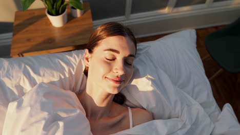 peaceful woman sleeping in morning sunlight