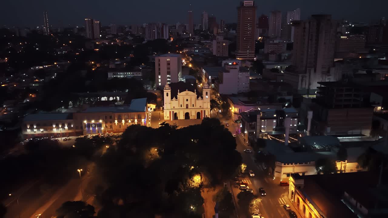 High angle night view of Metropolitan Cathedral, Plaza Juan de Salazar, Centro de Políticas Públicas and downtown Asunción skyline